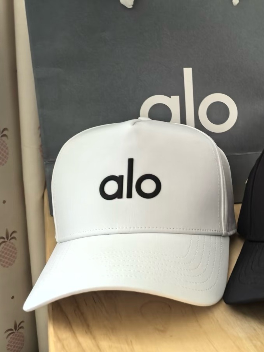 ALO Yoga white hat with black logo